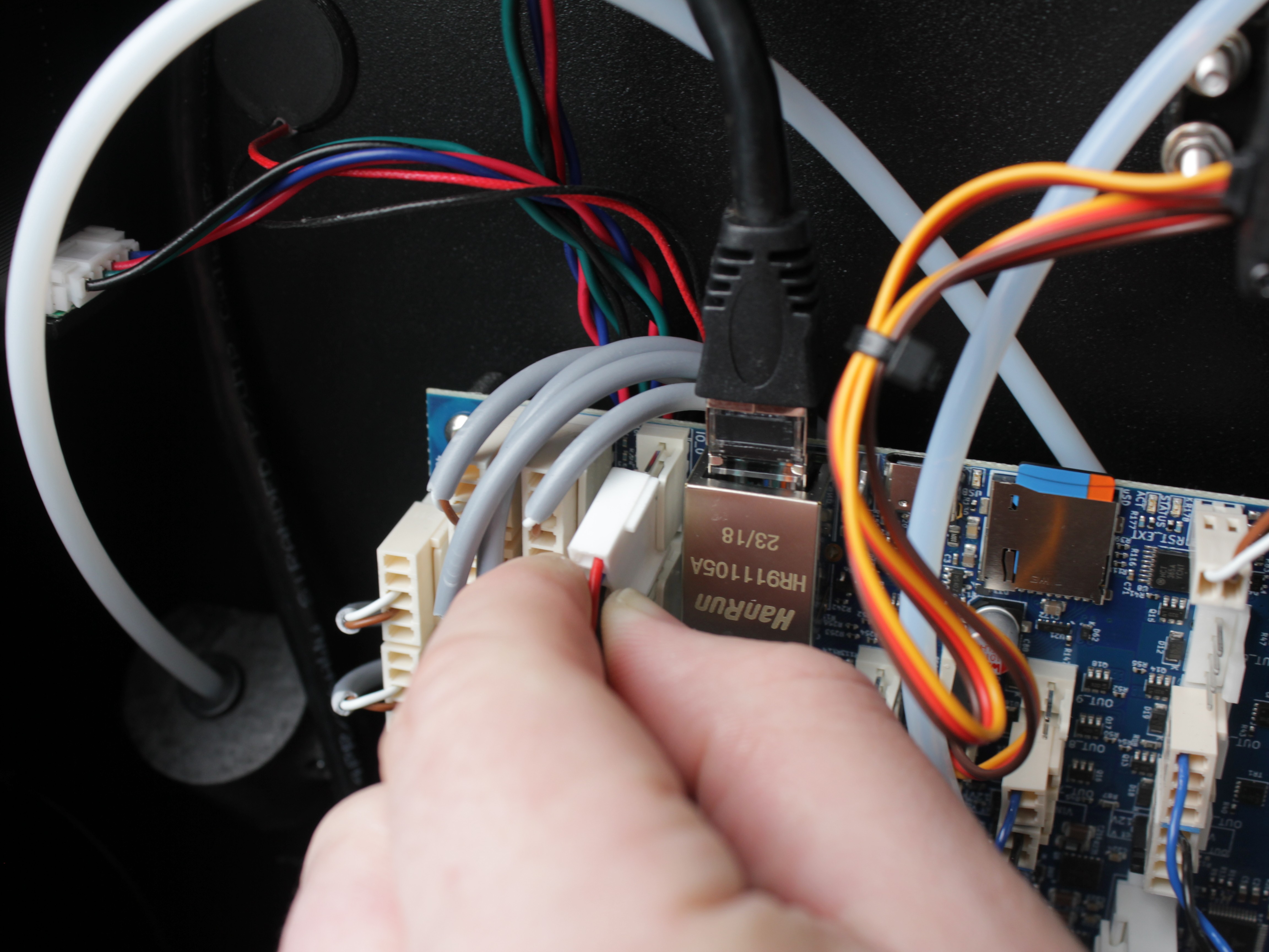 Connecting touchscreen ribbon cable to mainboard connector